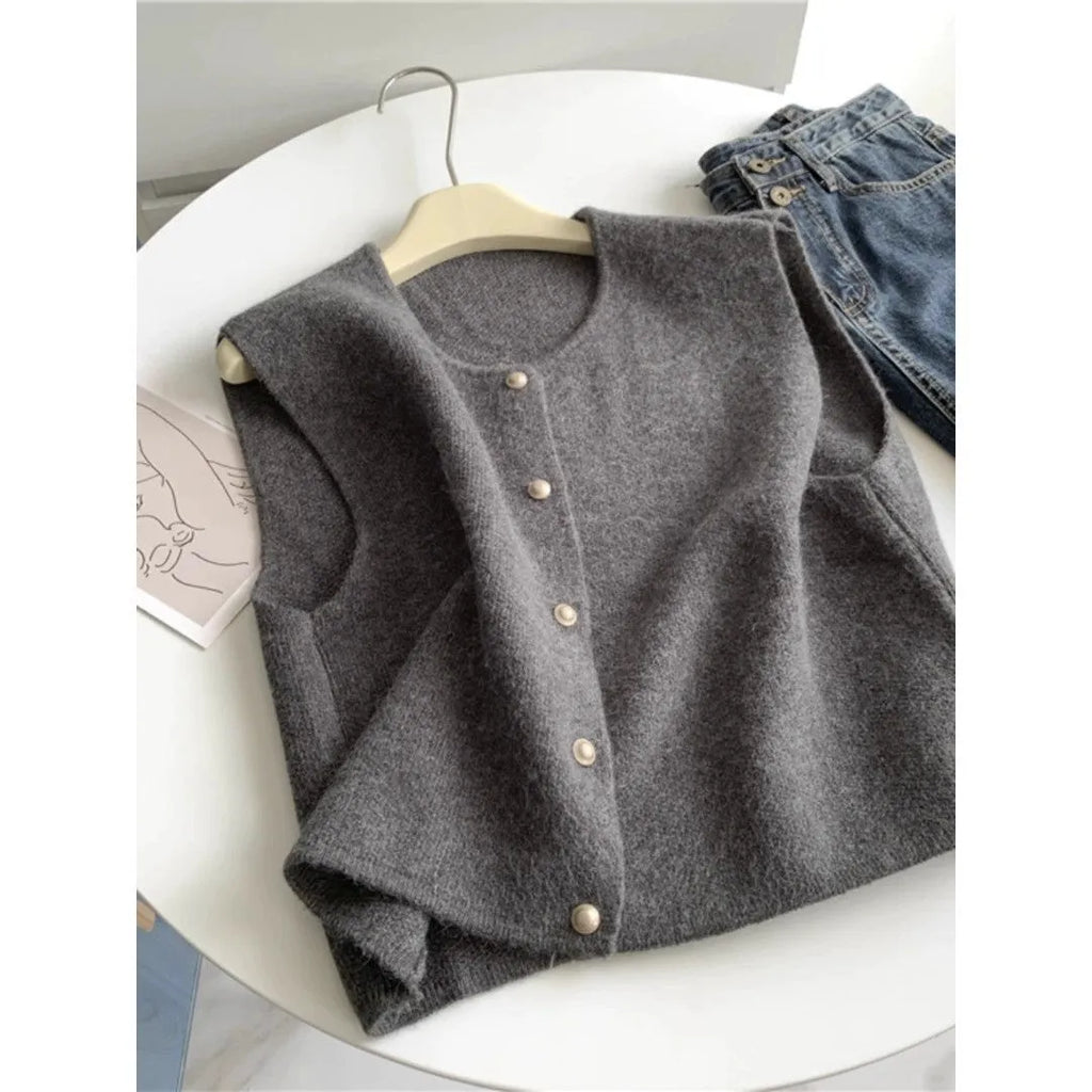 A smoky grey polyester half-sleeve pullover vest laid flat, showing its regular sleeve and commuter style.
