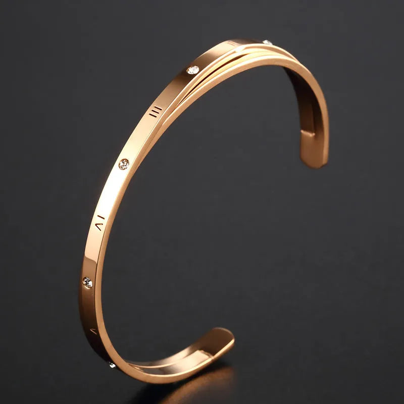 Open-ended stainless steel women's bracelet with zircon stones in rose, gold, or steel colour.