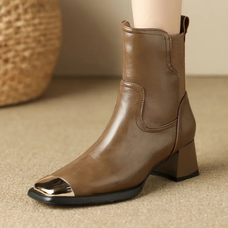 Brown high-heel Martin boots with side zipper and decorative metal rivet details.