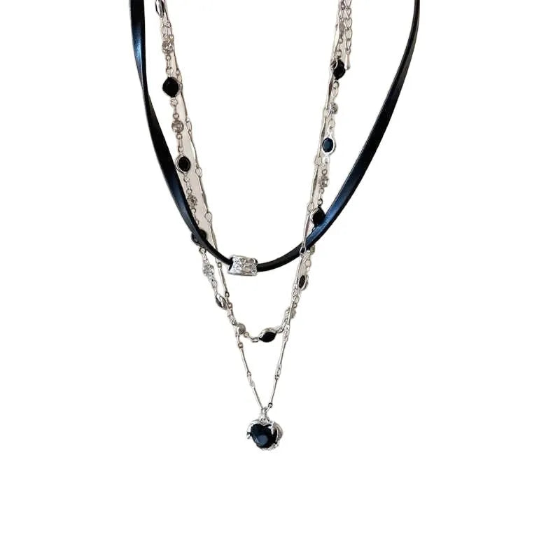 Women's twin necklace set with leather heart pendants on an adjustable alloy clavicle chain.