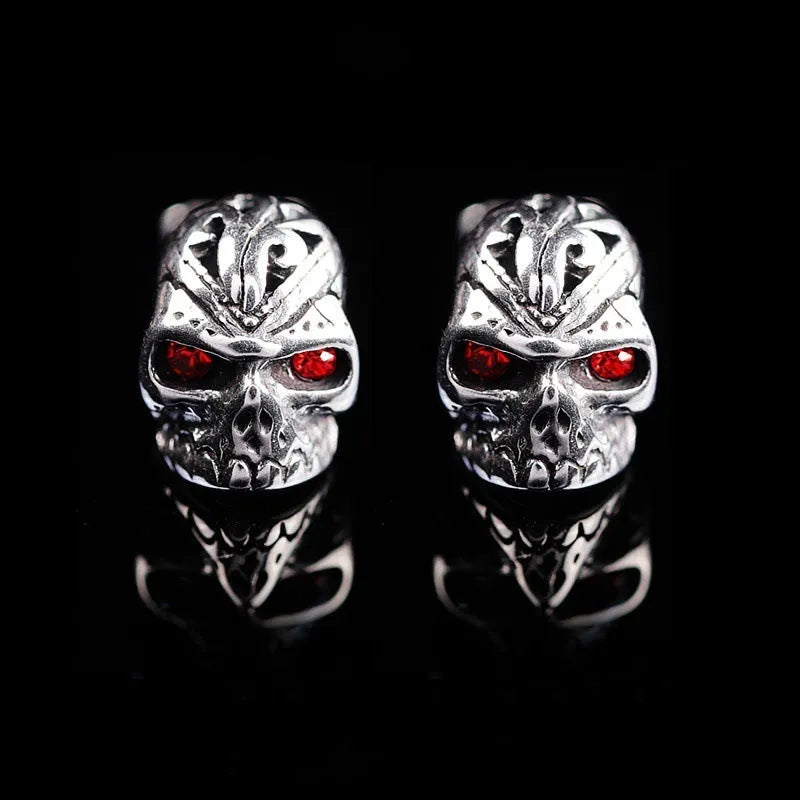 Retro skull stud earrings with red eye detailing on alloy metal with electroplated finish