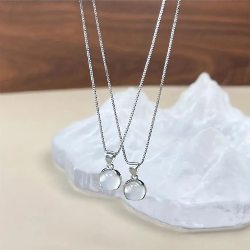 Women's silver-tone adjustable necklace with a clear oval crystal star pendant on a box chain.