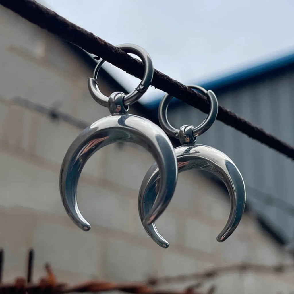 Silver geometric hoop earrings with moon detail and clip-on back