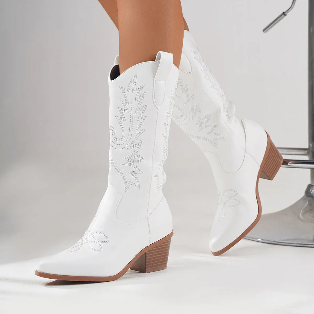 White women's Western cowboy knight boots with mid heel, pointed toe, microfiber upper, and rubber sole
