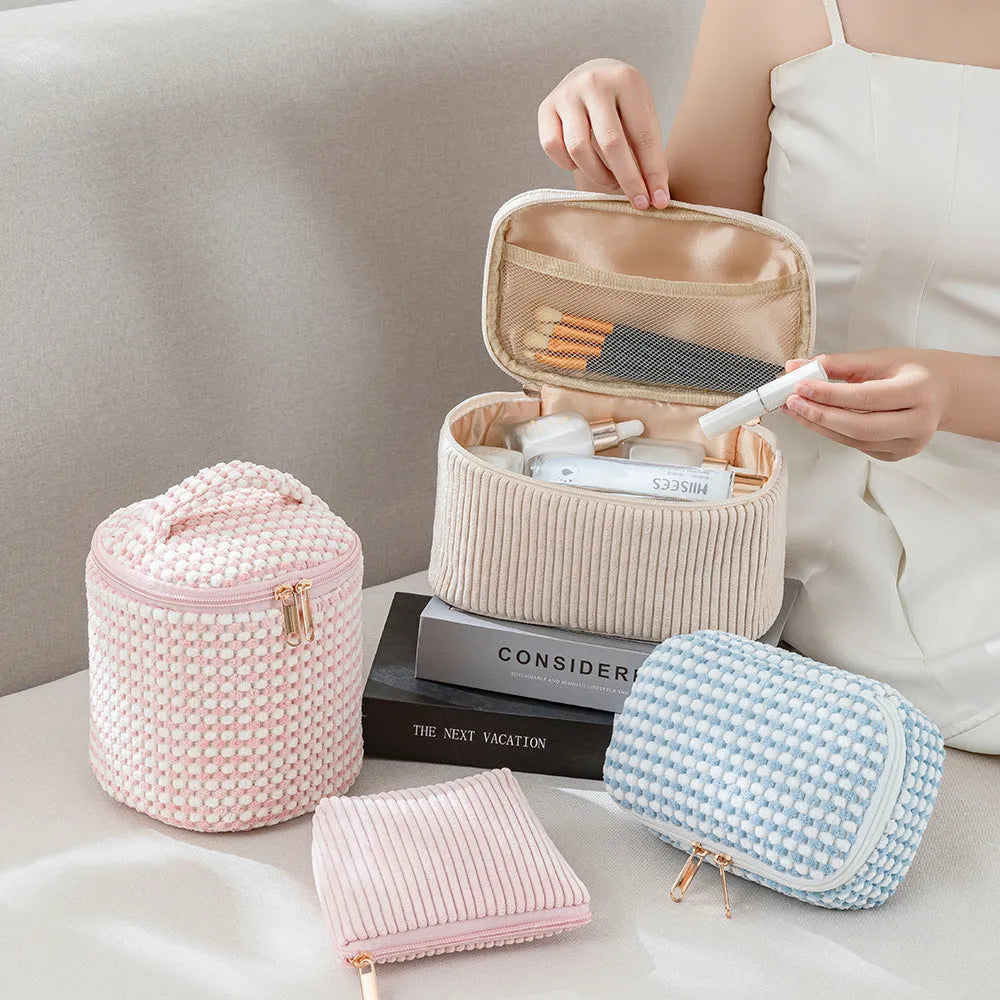 Flannelette makeup bag four-piece set in cube style, showing colour options of pink, khaki, pink dots, and blue with dots.