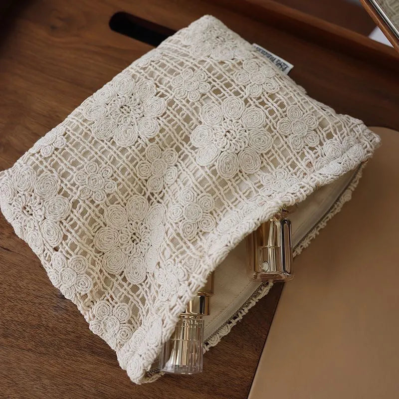 Handmade crocheted hollow flower cosmetic bag with ethnic embroidery on solid colour corduroy fabric