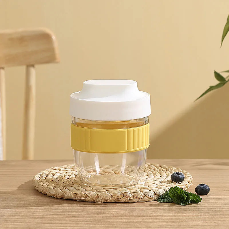 Green plastic salad cup with clear lid and integrated spoon showing 480ml capacity measurement