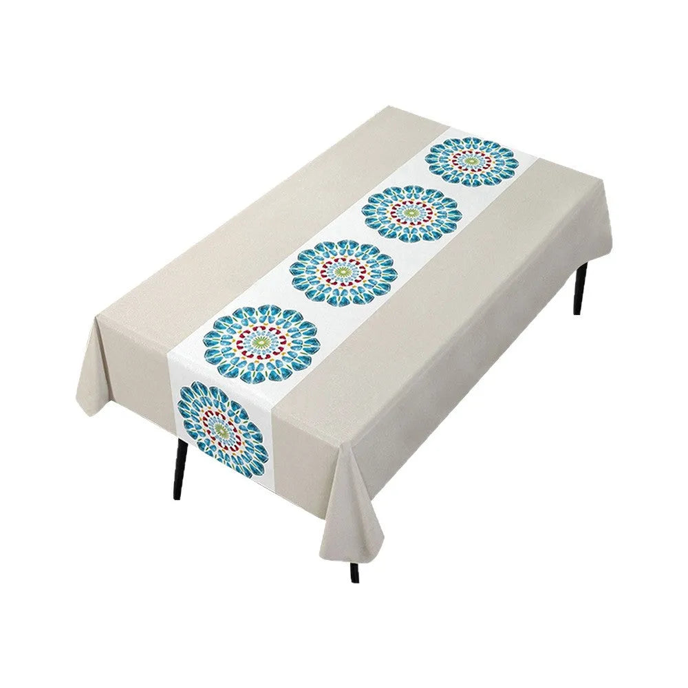Rectangular PVC tablecloth on a coffee table, showing a geometric pattern and non-slip backing.