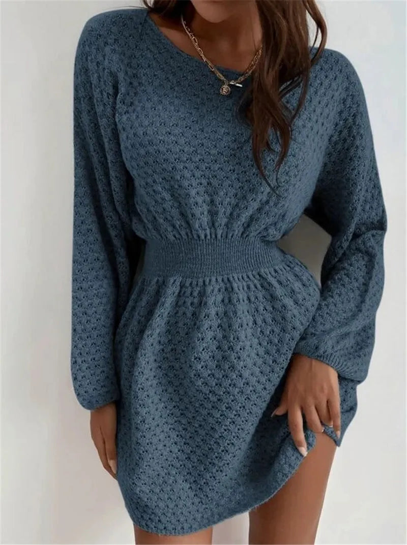 Blue women's knitted dress with hand-crocheted floral details and a fitted waist.