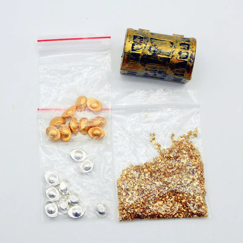 Alloy gold coin and bar treasure chest miniature doll house accessory on display.