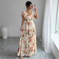 Apricot floral print women's dress with v-neck, ruffled sleeves, and a high-waisted long swing skirt.