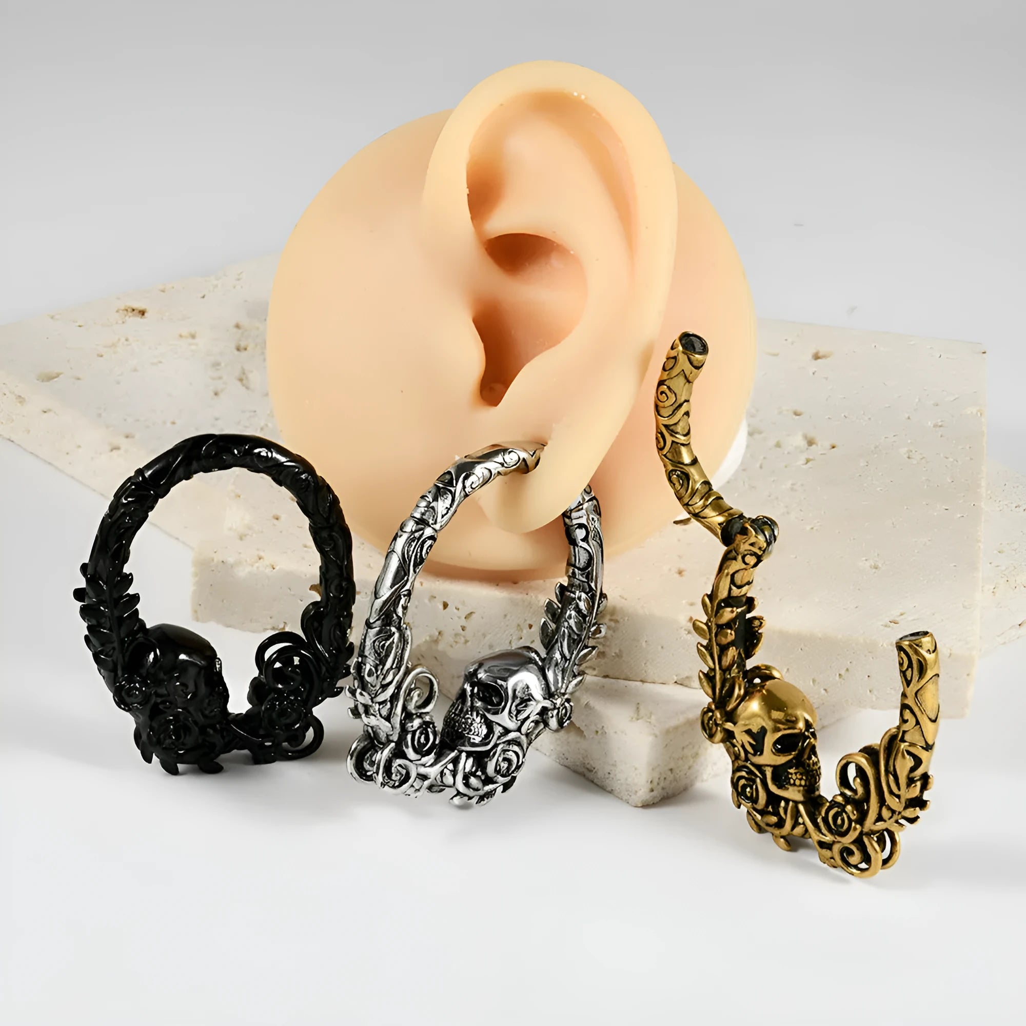 A pair of fashion earrings with a raised totem pattern, made from stainless steel in one of 15 available colour finishes.