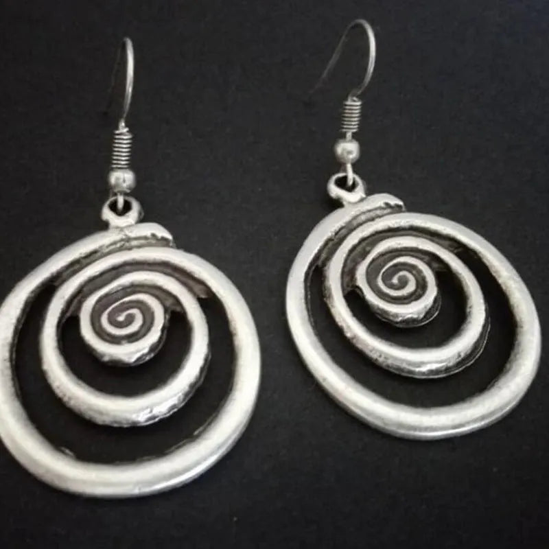 Silver geometric spiral distressed earrings with tribal design measuring 2.6 by 5 cm