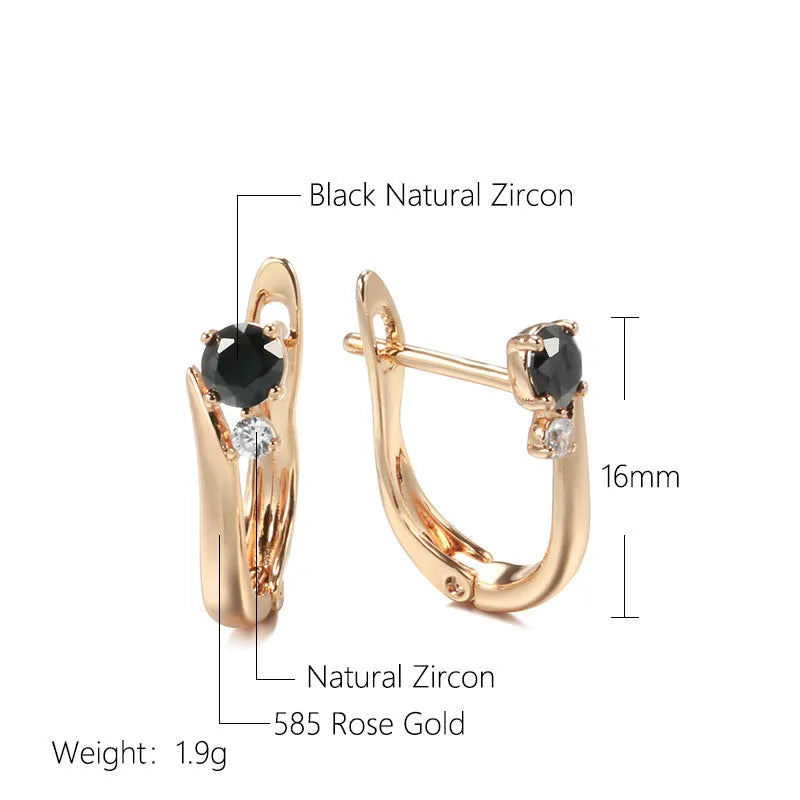 Gold-coloured drop earrings with geometric black agate design and retro styling