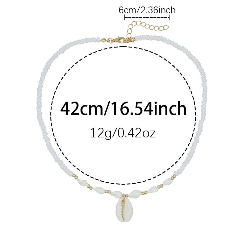 White conch shell necklace with mother-of-pearl pendant on electroplated chain with bead accents