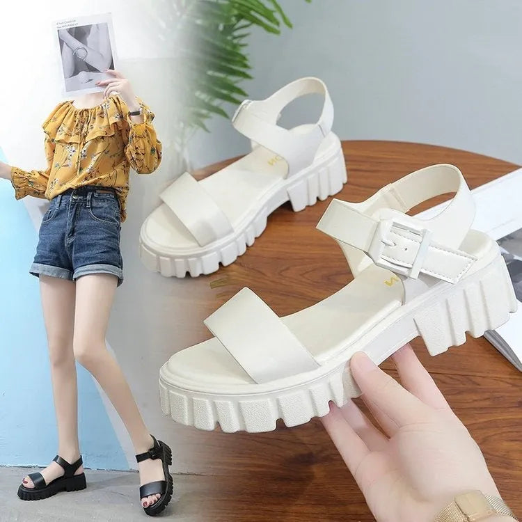 Women's beige peep toe sandals with an ankle strap buckle and a platform sole, shown from the side.