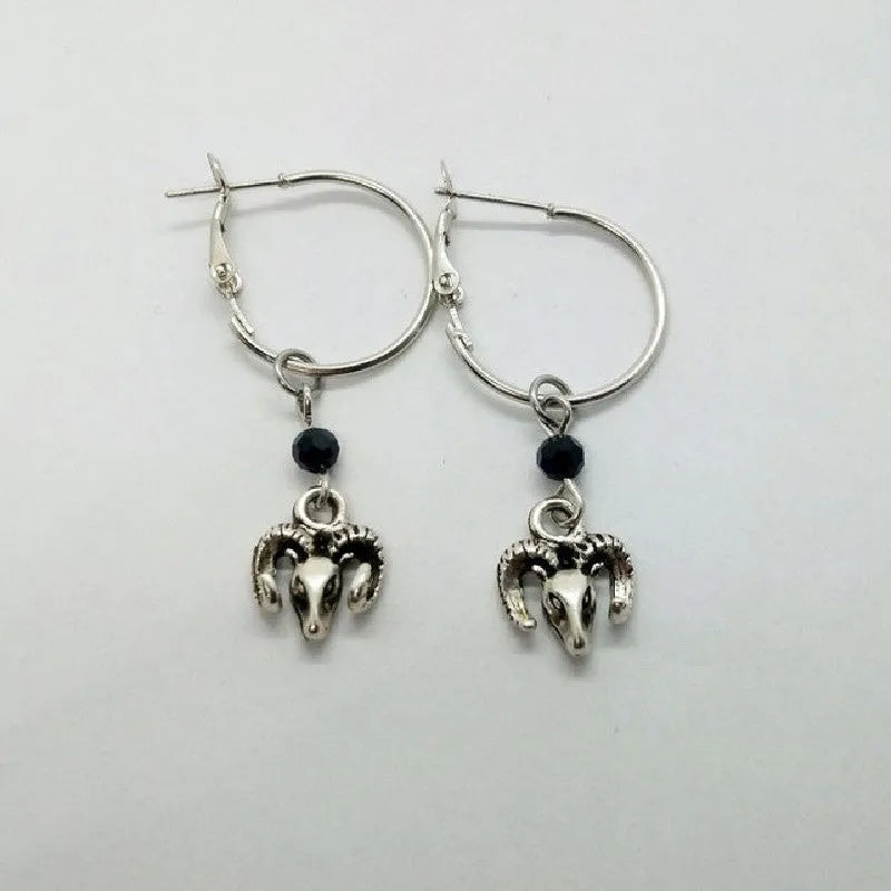 Silver-coloured alloy round ring earrings for women with a Tibetan antelope design.