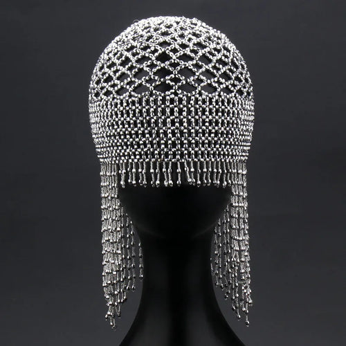 Silver belly dance hat with beaded tassels on black background for performance hair ornament
