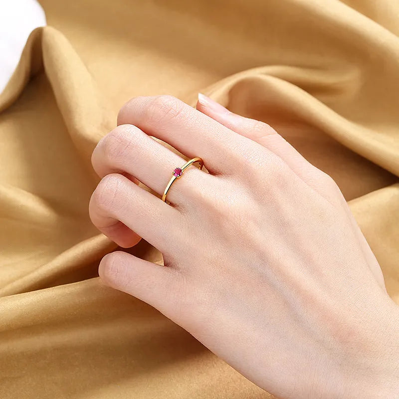 Geometric copper women's ring with single diamond in circle design, shown in available colours.