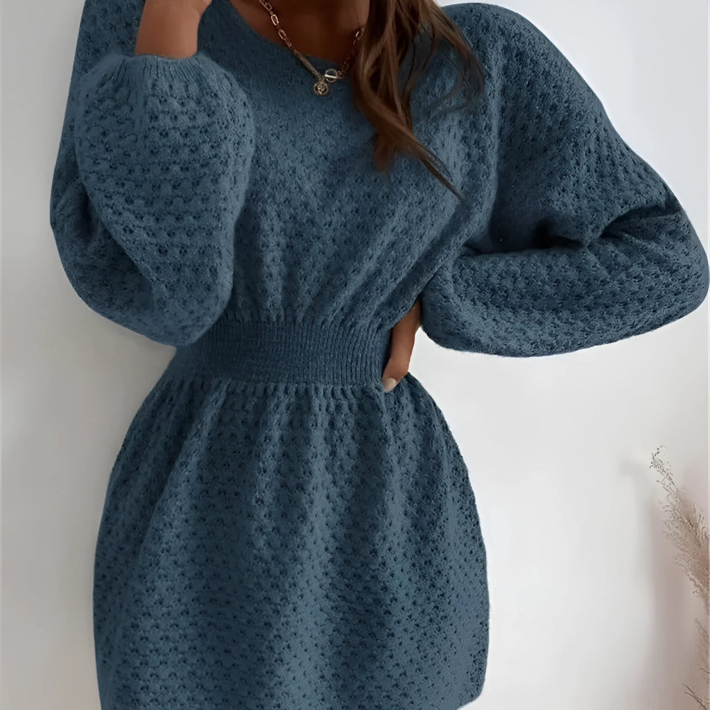 Blue women's knitted dress with hand-crocheted floral details and a fitted waist.