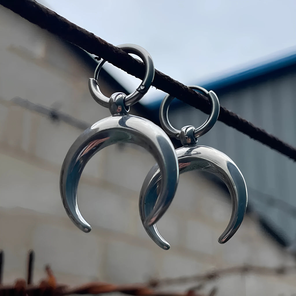 Silver geometric hoop earrings with moon detail and clip-on back