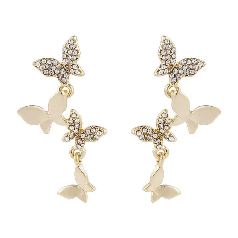 Gold tone butterfly drop earrings with copper construction for women
