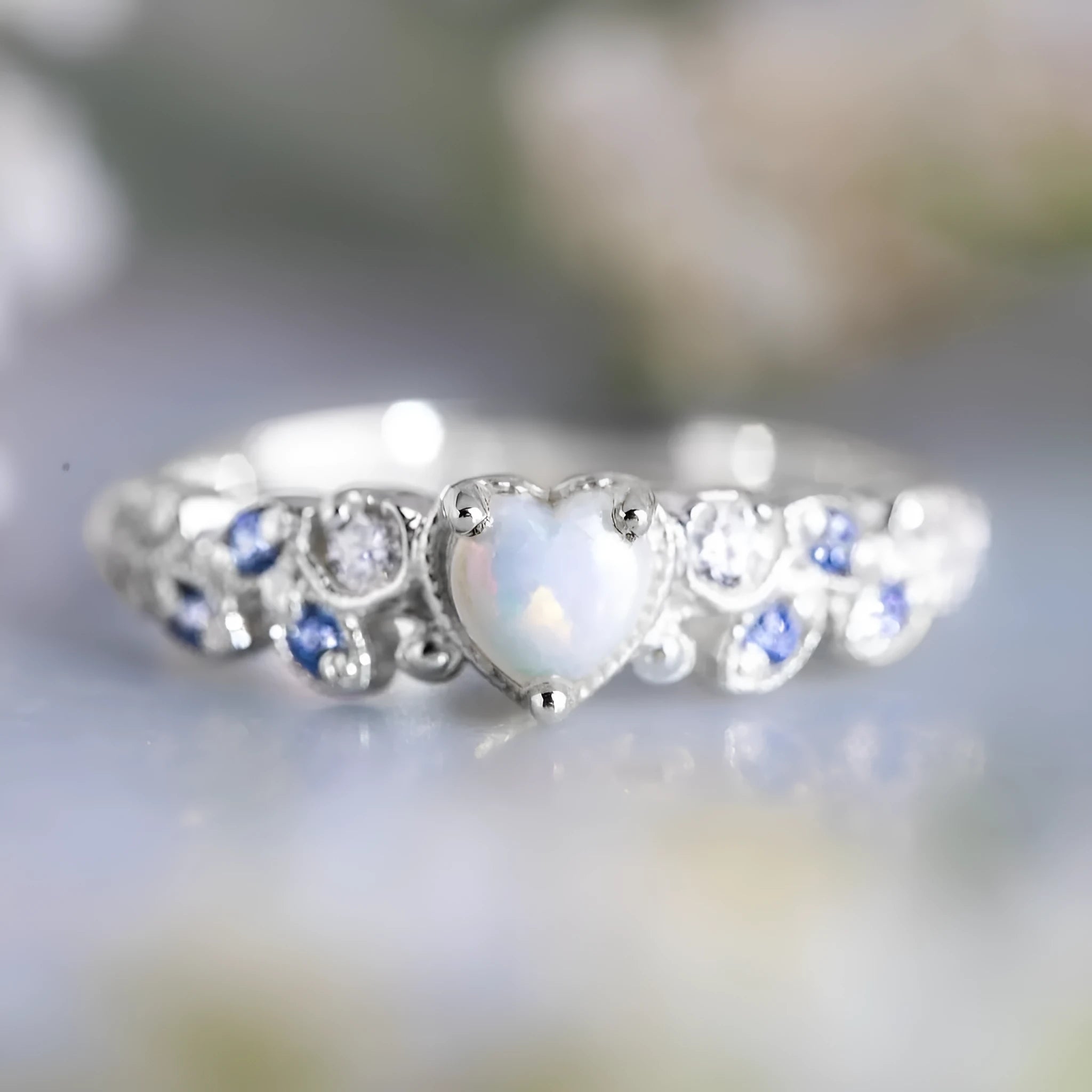 White alloy peach heart-shaped women's ring with floral and ocean opal detailing.