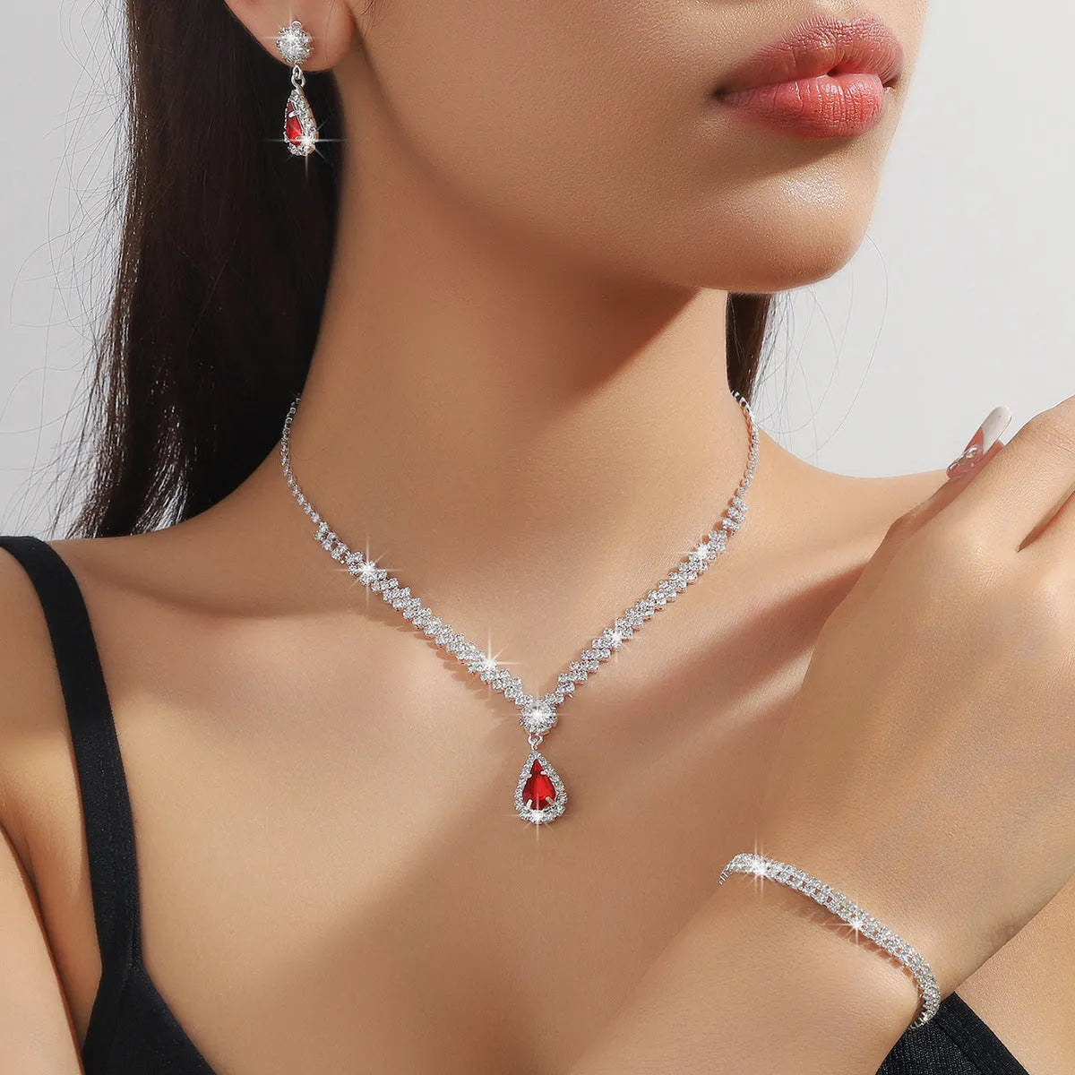 Claw chain necklace and earrings set with drop rhinestones in multiple colour options