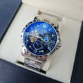 Men's silver automatic mechanical watch with black starry dial on leather strap showing transparent case back