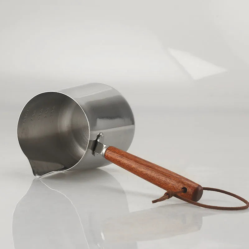 Stainless steel coffee cup with wooden handle shown in simple solid colour, available in 350ml, 600ml or 1000ml capacities.