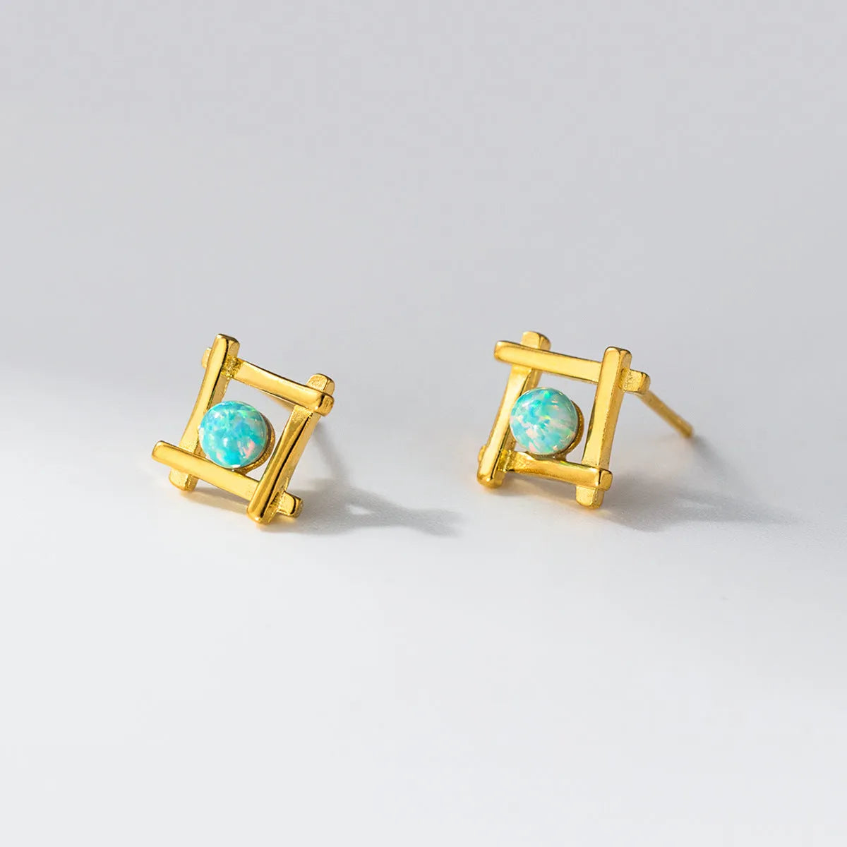 Geometric cross quadrangle stud earrings in S925 silver with Seiko treatment