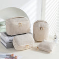 Flannelette makeup bag four-piece set in cube style, showing colour options of pink, khaki, pink dots, and blue with dots.