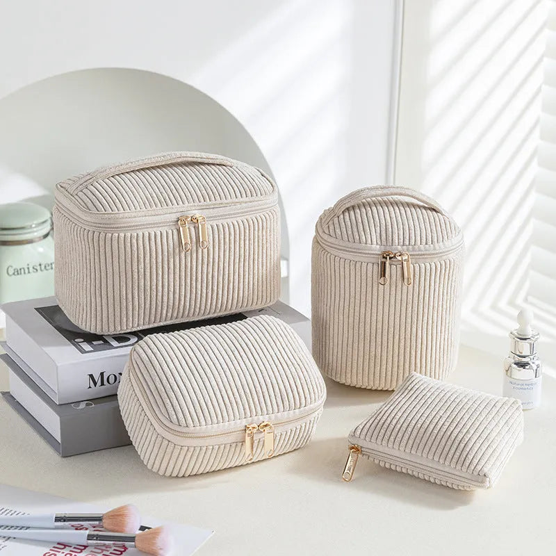 Four cube-style flannelette makeup bags in a set, shown in a blue with dots colour theme.