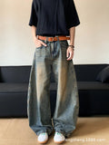 Man wearing Retro Blue distressed wide-leg denim jeans with a slimming silhouette and mid-waist fit.