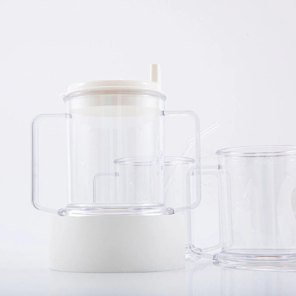Transparent plastic spill-proof drinking cup on a table