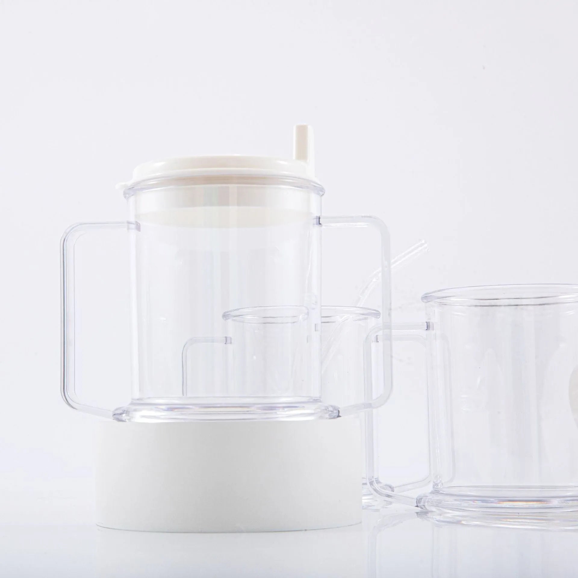 Transparent plastic spill-proof drinking cup on a table