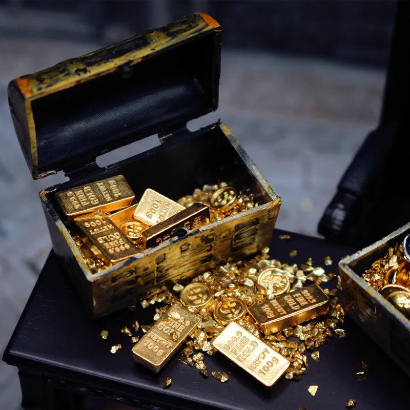 Alloy gold coin and bar treasure chest miniature doll house accessory on display.