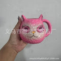 Colourful resin cat cup figurine on a shelf, shown in purple, green, blue, and pink colour options.
