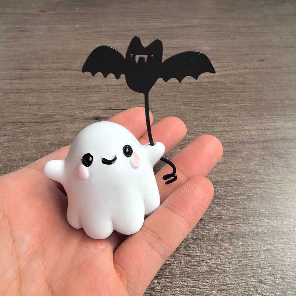 Mini resin statue of a white ghost walking a black bat, Halloween decoration