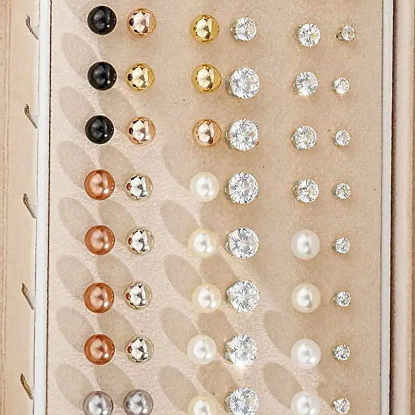 108-piece assortment of gold and yellow alloy stud earrings with geometric shapes and round pearls.
