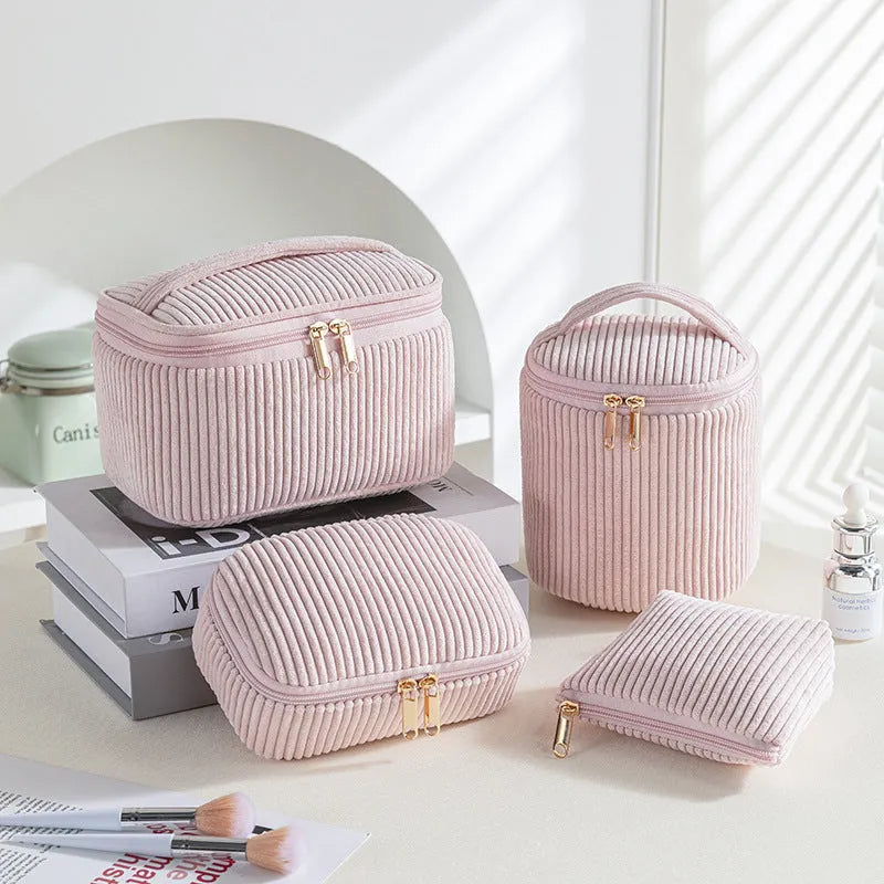 Four cube-style flannelette makeup bags in a set, shown in a blue with dots colour theme.