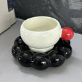 Ceramic coffee cup and saucer set in a simple Nordic design, shown in a choice of colours.
