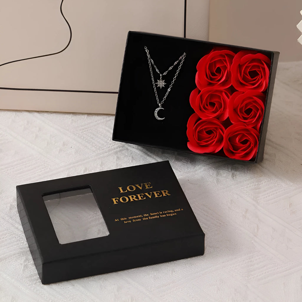 Red Korean-style gift box open to show six sculpted soap roses, with a matching handbag beside it.