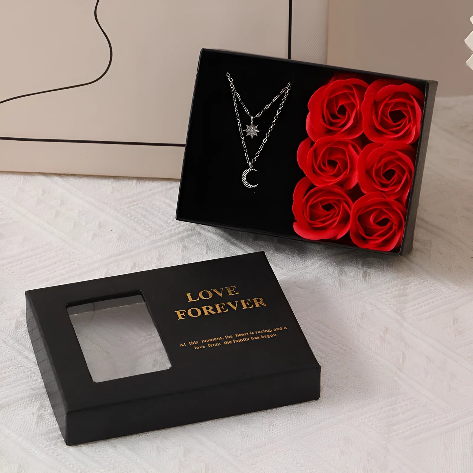 Red Korean-style gift box open to show six sculpted soap roses, with a matching handbag beside it.