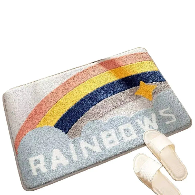 Rainbow pattern floor mat in sky blue and white colours with a flat polyester pile and plastic backing.