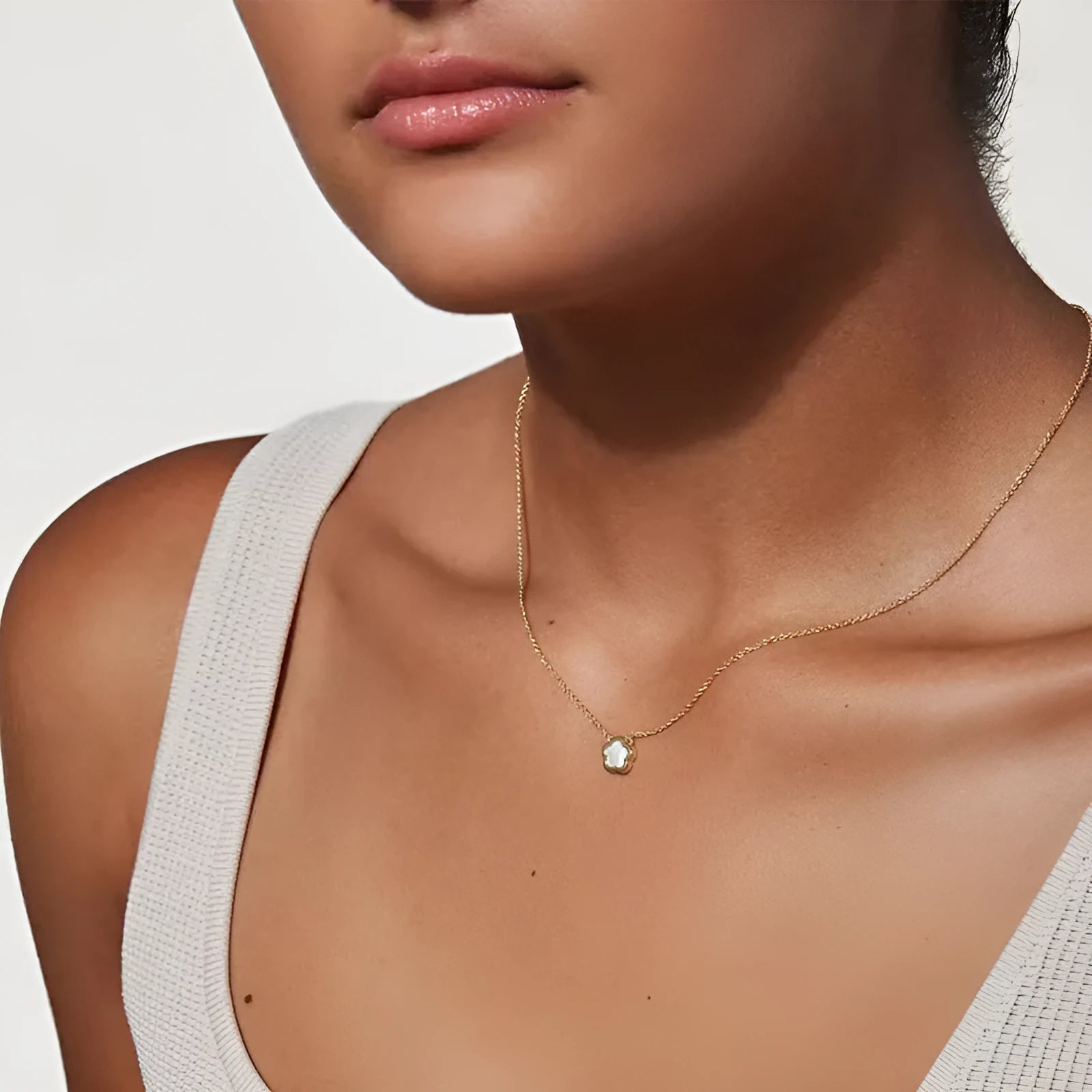 White mother-of-pearl flower necklace with floral pendant on chain