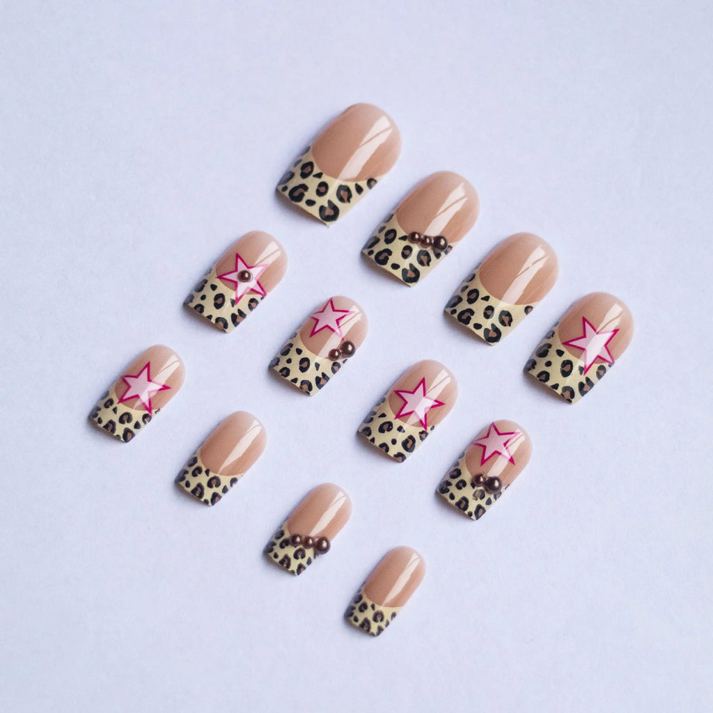 French style leopard print nail art strips with pearl and five-pointed star decorations for manicures.