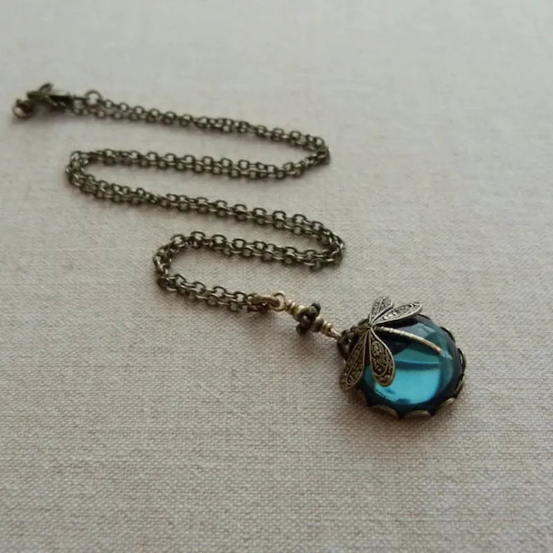 Yellow vintage bronze dragonfly pendant necklace on silver chain