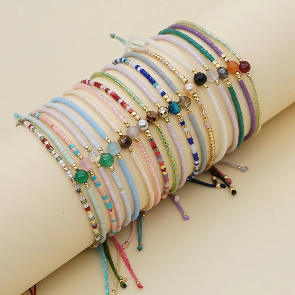 Handmade women's colourful beaded bracelet with geometric glass beads in bohemian style