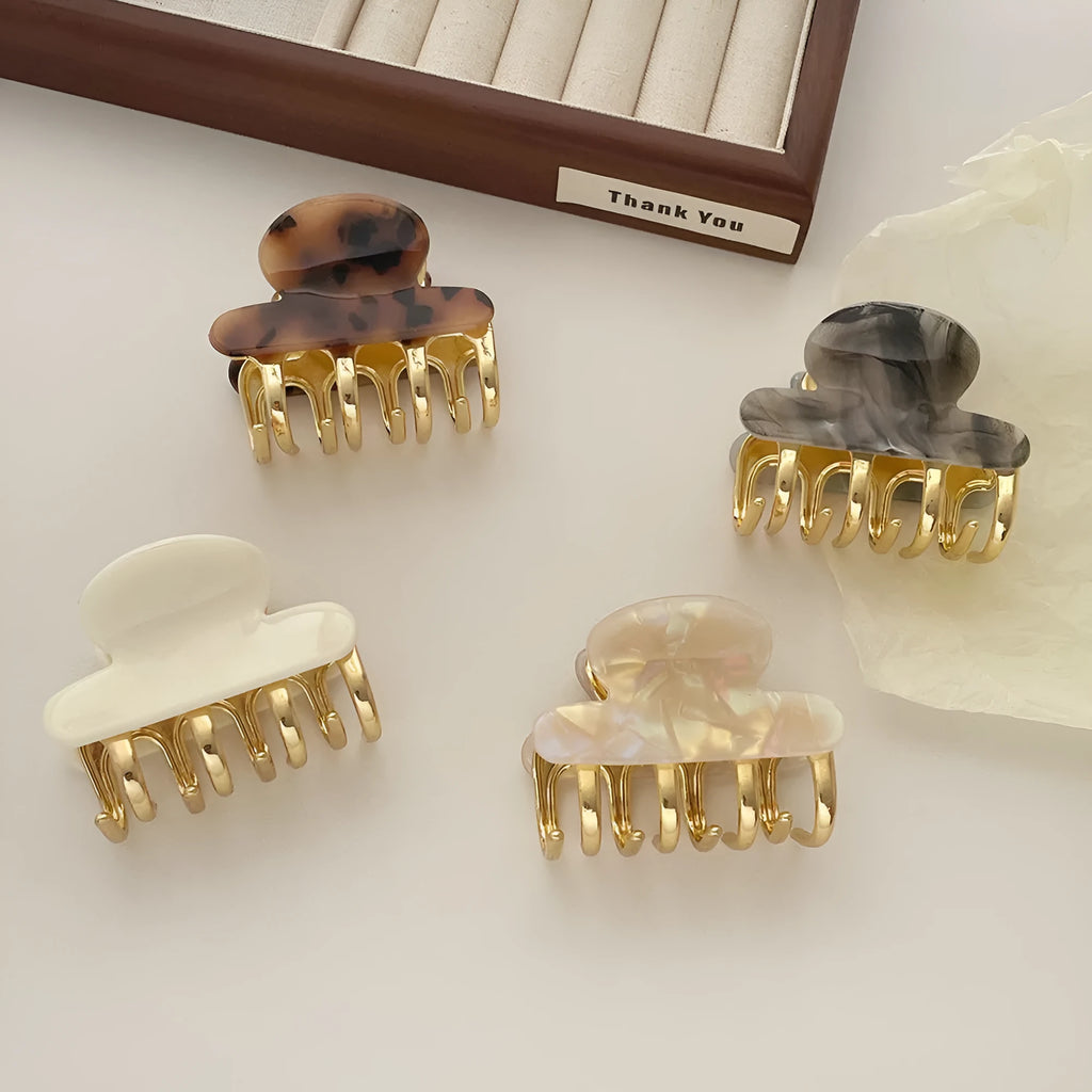 Women's hair barrettes with metal grip in alloy acrylic showing four colour options